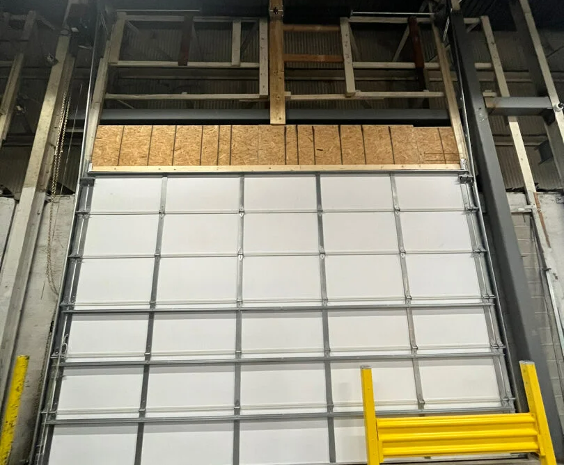 a professional technician conducting overhead garage door repair in Cloud, FL, showcasing reliable and efficient repair services.