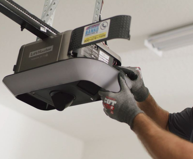 a skilled technician repairing a garage door opener with a set of professional tools, highlighting the expert garage door opener repair services offered by Garage Door Repair Services Cloud FL.