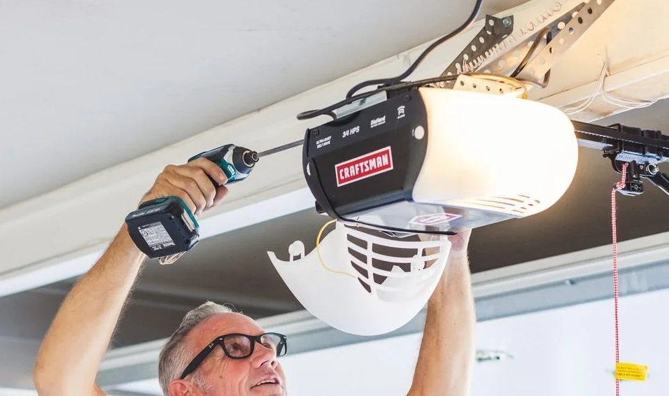 Technician repairing a garage door opener in Florida - Expert Garage Door Repair Services.